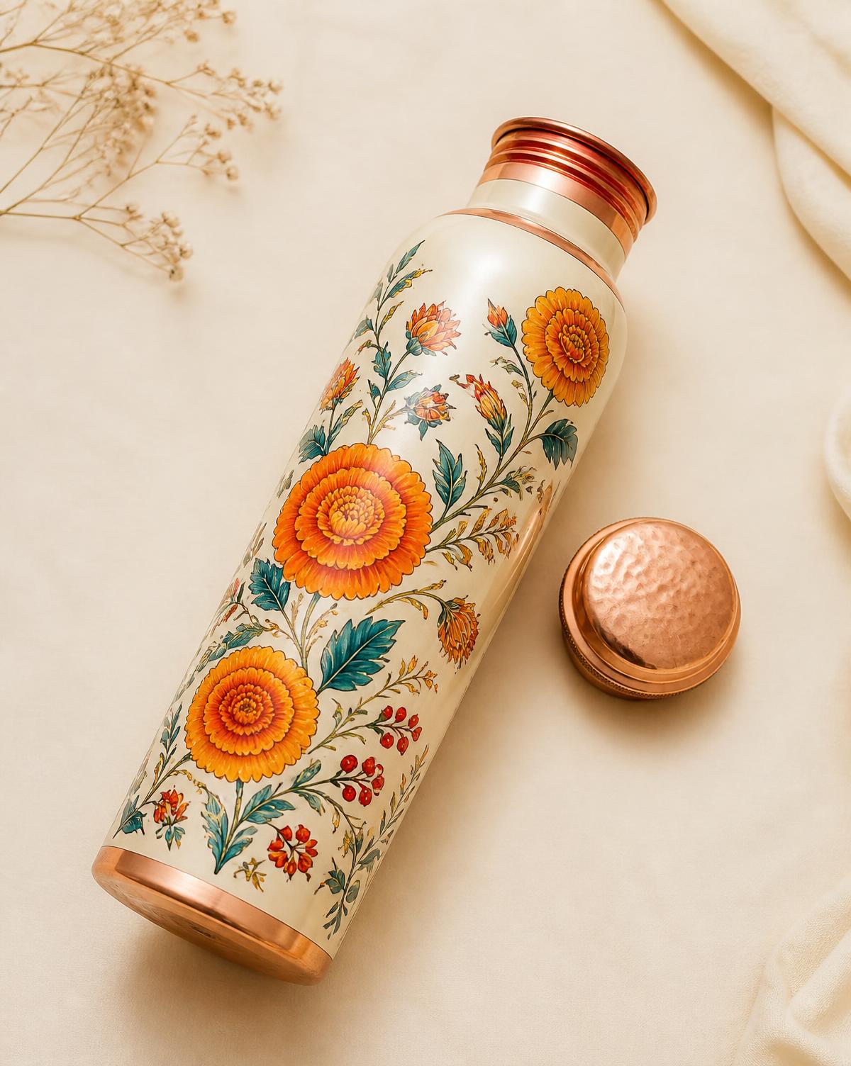 Floral copper bottle with cap unscrewed